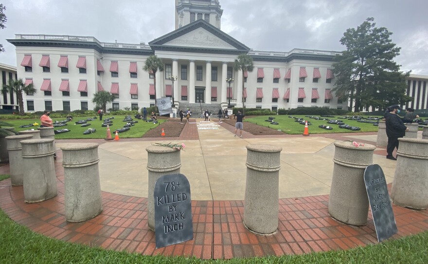 The Florida Prisoner Solidarity created a mock-graveyard on the capitol grounds.