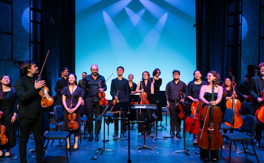 Francisco Fullana, Artistic Director of the CMI210 Festival, congratulates the performers.
