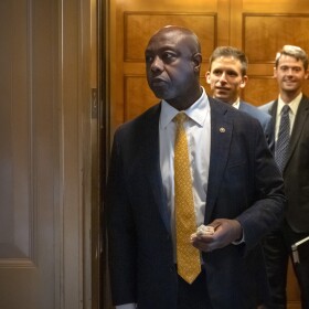 Sen. Tim Scott, R-S.C., steps out of an elevator as Republicans begin a final push to advance President Donald Trump's tax breaks and spending cuts package, at the Capitol in Washington, Monday, June 30, 2025.