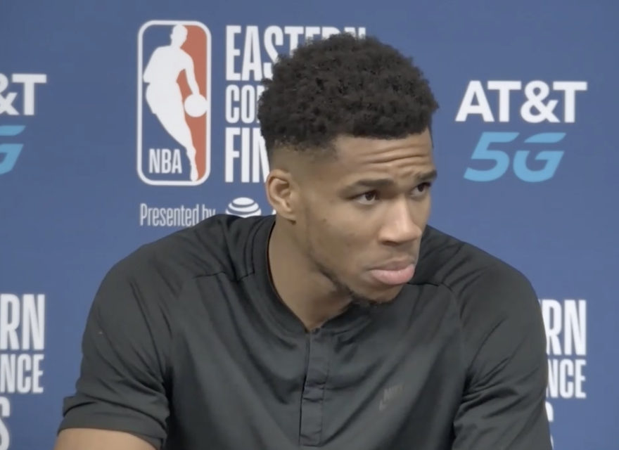 Giannis Antetokounmpo listens to a question during Wednesday night's postgame news conference.