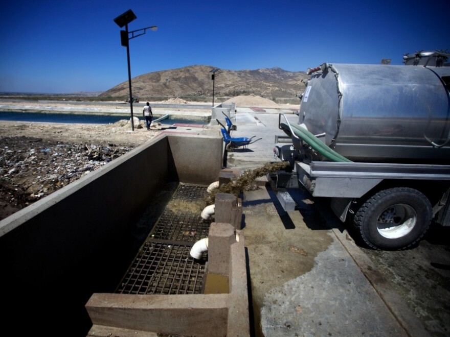 A truck discharges raw sewage from Port-au-Prince into a brand-new treatment plant outside the city. It's one of two that will soon handle the entire effluent from the Haitian capital, which has a population of 3 million.