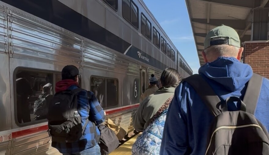 Travelers move across the platform at Fort Worth Central Station.