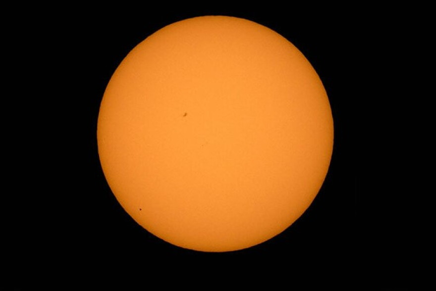 The planet Mercury is seen in silhouette, lower third of image, as it transits across the face of the sun Monday, May 9, 2016, as viewed from Boyertown, Pennsylvania. Mercury passes between Earth and the sun only about 13 times a century.