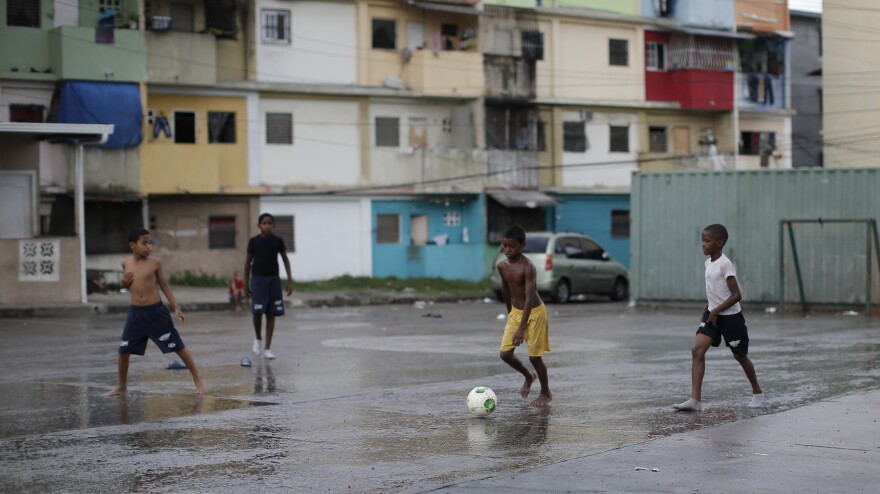 Children in a poor Panama City neighborhood play soccer on May 14. The Panama Canal has brought rapid development to the capital in recent years, but 40 percent of the country's residents still live in poverty.