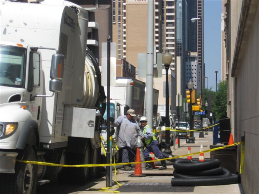 Workers Pumping Water From Records Building