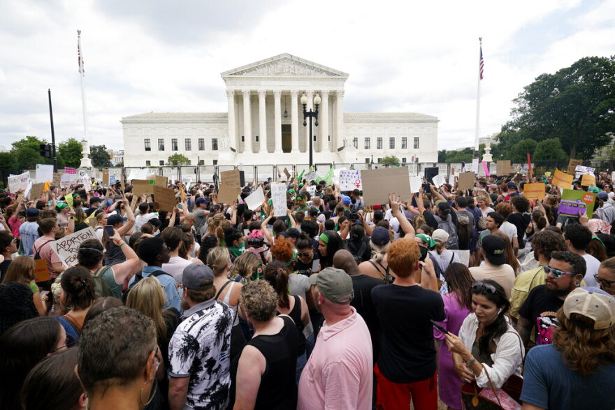 Protesters gather outside the Supreme Court in Washington, Friday, June 24, 2022. The Supreme Court has ended constitutional protections for abortion that had been in place nearly 50 years, a decision by its conservative majority to overturn the court's landmark abortion cases. (AP Photo/Steve Helber)