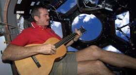 To pass the time, Canadian Astronaut Chris Hadfield plays guitar. His music videos made quite the splash on social media. Photo: NASA