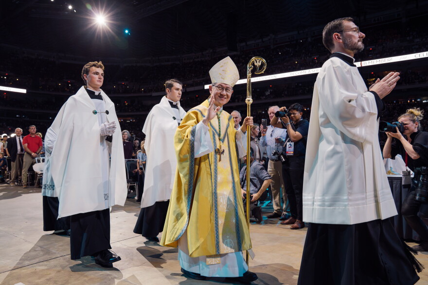 Cardinal Luis Antonio Tagle waves to the crowd while processing into the beatification Mass for the late Archbishop Fulton J. Sheen on Thursday at the Dome at America's Center in downtown St. Louis.