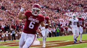 Junior quarterback Baker Mayfield celebrates after scoring a touchdown at Gaylord Memorial Stadium, Saturday, Sep. 19, 2015.