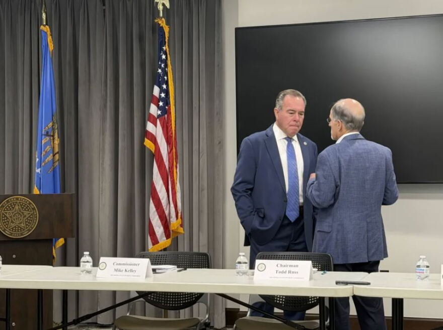 Oklahoma Treasurer Todd Russ, left, talks with Mark Wood, director of the Office of Management and Enterprise Services, before a meeting of the State Pension Commission at the Capitol in Oklahoma City on Tuesday, Sept. 1, 2026.