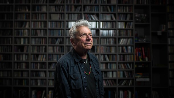Joe Ely in the KUTX music library posing for a photo.