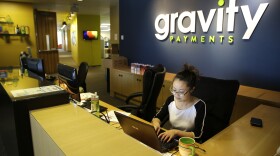 Cary Chin works at the front desk of Seattle-based Gravity Payments. CEO Dan Price told his employees that he was cutting his own salary and using company profits so they would each earn a base salary of $70,000.