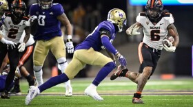 Oregon State's Damien Martinez carries the ball in the Beavers' Nov. 4, 2022 match-up with University of Washington in Seattle.