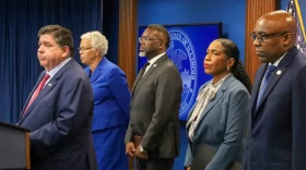 Gov. JB Pritzker, left, speaks at a Sept. 2 news conference to reporters ahead of potential military deployments in Chicago. Pictured behind him, from left to right: Cook County Board President Toni Preckwinkle, Chicago Mayor Brandon Johnson, Lt. Gov. Juliana Stratton and Attorney General Kwame Raoul.