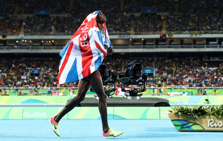 Mo Farah of Great Britain celebrates after winning the men's 10,000 meters on Saturday, defending his title from the 2012 London Games. Farah stumbled and fell during the race, but recovered to win with a blistering kick on the final straightaway.