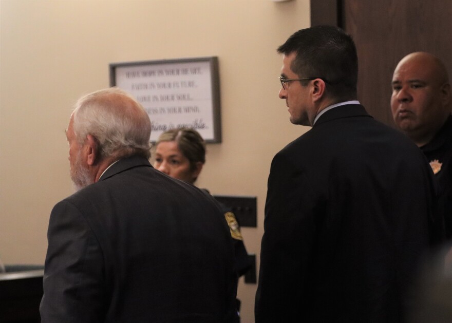 Juan David Ortiz (right) stands with one of his attorneys