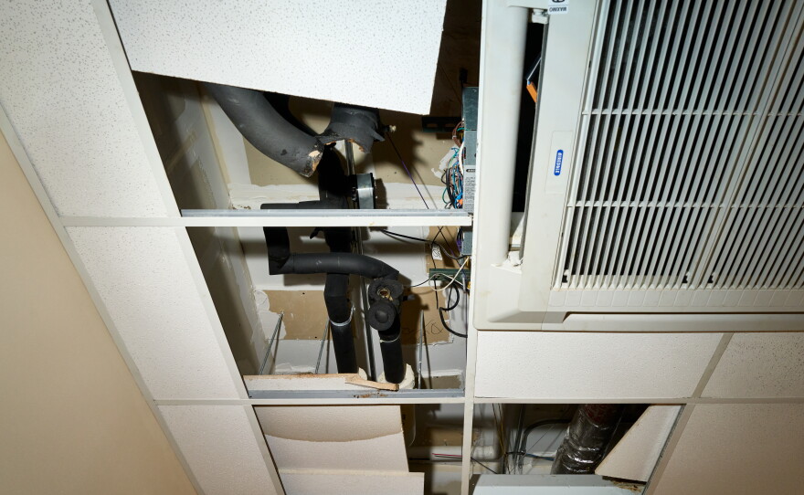 Waterlogged tiles are moved out of the way for repairs to the HVAC system at Olds Elementary School on Wednesday October 7, 2026.