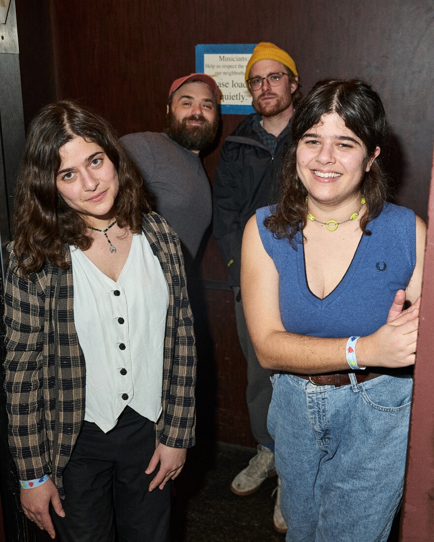 Dubb Nubb's four members pose in a doorway. Twins Delia and Hannah stand in front, while the two newest members, Josh and Todd, stand behind. 