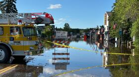 Downtown Cook is barricaded as floodwaters continue to rise Wednesday night, June 19, 2024, following heavy rainfall in northeastern Minnesota.