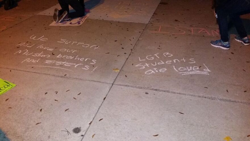 Protesters also chalked anti-hate messages outside Royal Oak Middle School.