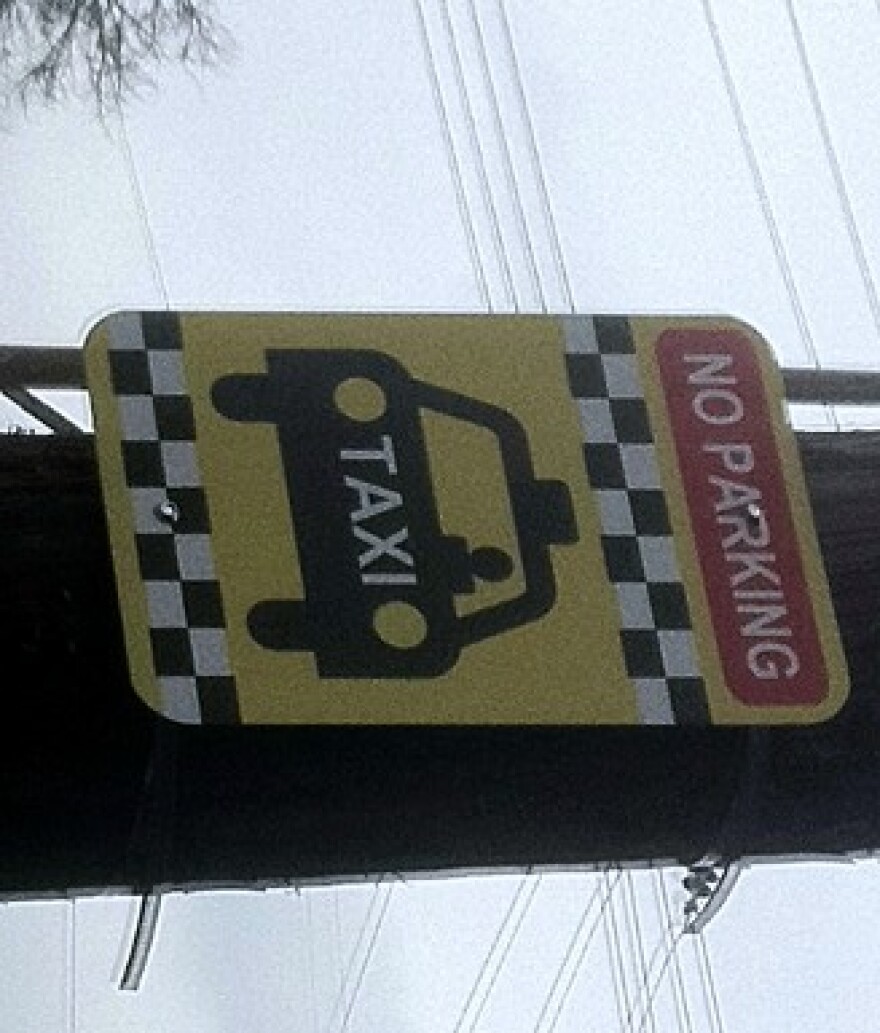 The Taxi Cab stand sign at 18th and Boston.