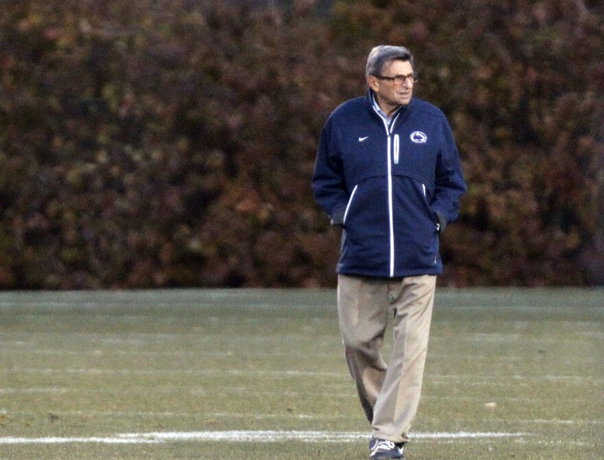 Alone on field for main Penn State coach Joe Paterno looks on during football practice on Wednesday.