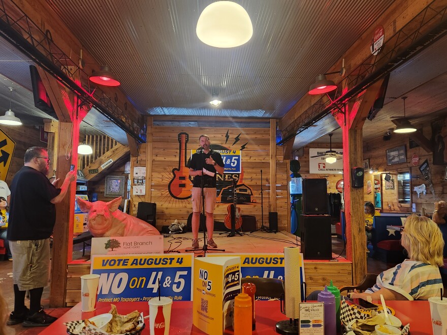 Micha Titterington, executive director of Community Outreach Ministries in Bolivar, speaks at a rally at Boone's BBQ Barn on July 28, 2026.