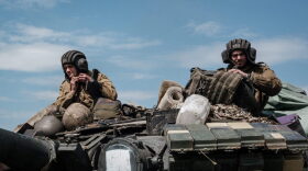 Ukrainian soldiers sit on a tank carried by a transporter near Bakhmut, eastern Ukraine  amid the Russian invasion of Ukraine.