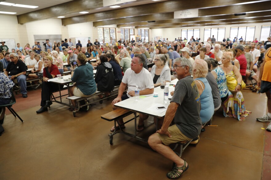 Residents from the lava-affected areas attend a community meeting at Pahoa High School in Pahoa on Friday.