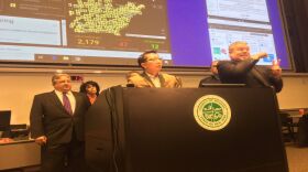 Monroe County Health Commissioner Dr. Michael Mendoza and other local officials brief reporters on Saturday