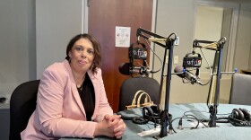 PACE Executive Director Rhiannon Edwards, pictured here in the WFYI studio, visited the station to discuss the program's new location.