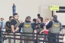 Federal immigration officers deployed at Southwest Florida International Airport as a government shutdown continues and Transportation Security Administration workers remained unpaid. Some TSA workers have quit or not shown for work due to not being paid.