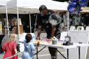 Children play with bubbles at Community Spring's block party.