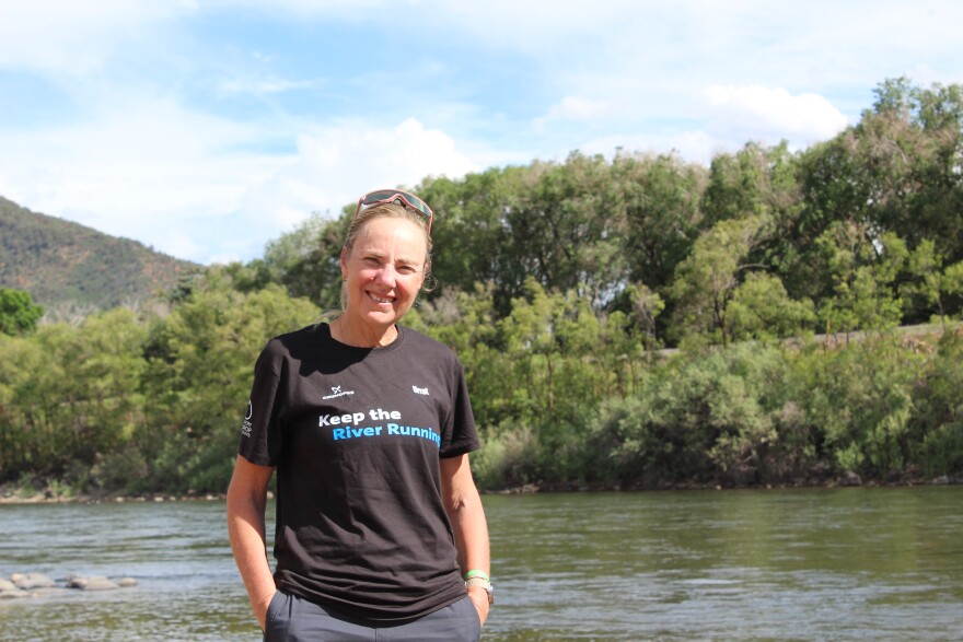 Mina Guli stands at the banks of the Colorado River in Glenwood Springs on June 26, 2026. She’s running the length of the river in a campaign to raise awareness and drive action to address its drought crisis.