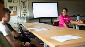 Amanda Valliere, right, talks to students in her civics and economics class during freshman orientation at Lebanon High School in Lebanon, N.H., on Tuesday, Aug. 25, 2026. Valliere told students that one of the first topics they will be discussing in the class is AI, and she asked them to think about their feelings on the subject. (Valley News photo)
