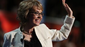 Former Rep. Gabrielle Giffords, D-Ariz., waves to the delegates at the Democratic National Convention.
