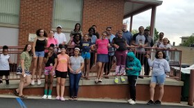 Students hang outside the Save Our Youth building in Jackson, MI. The program offers a variety of programs that help mentor youth in the area.