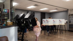 Voters fill out their ballot at a voting booth during the 2022 Kansas primary election at Argentine Community Center in Wyandotte County.