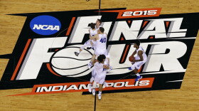 FILE - Duke players celebrate after the NCAA Final Four college basketball tournament championship game against Wisconsin in Indianapolis, in this Monday, April 6, 2015, file photo. The NCAA announced Monday, Nov. 16, 2020, it plans to hold the entire 2021 men’s college basketball tournament in one geographic location to mitigate the risks of COVID-19 and is in talks with Indianapolis to be the host city.