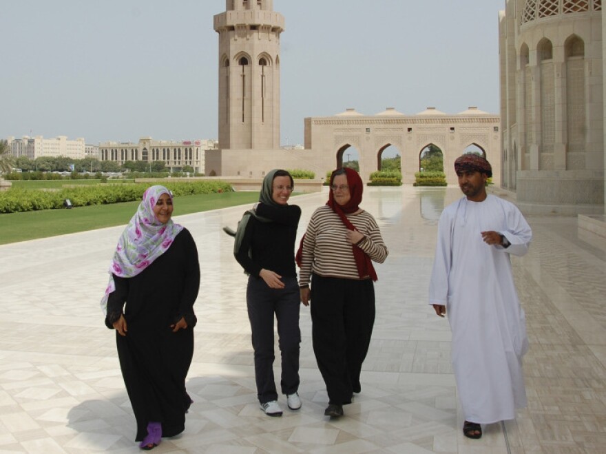 In this photo released by the U.S. Embassy in Oman, Sarah Shourd (second from left) visited the Sultan Qaboos Grand Mosque in Muscat after her release from Iran last year.