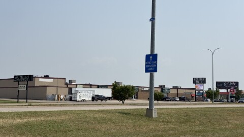 The city of Devils Lake is protected by a massive dike. On light poles throughout town, signage demonstrating how high the water is posted. The current signage is out of date, though - the level is about two and a half feet higher.