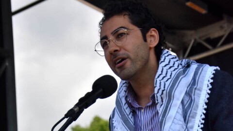 Mahdawi speaking to crowds at the "No Kings" rally in Burlington, Vermont Saturday.