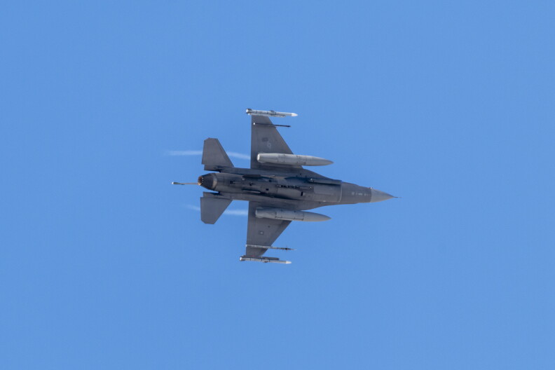 A U.S. Air Force F-16 Fighting Falcon, assigned to Ohio National Guard’s 180th Fighter Wing, flies over the flightline before landing at Joint Base Elmendorf-Richardson, Alaska, during U.S. Northern Command Exercise ARCTIC EDGE 2022, March 14, 2022. AE22 is a biennial homeland defense exercise to provide high quality and effective joint training in austere cold weather conditions. (U.S. Air National Guard photo by Staff Sgt. Kregg York)