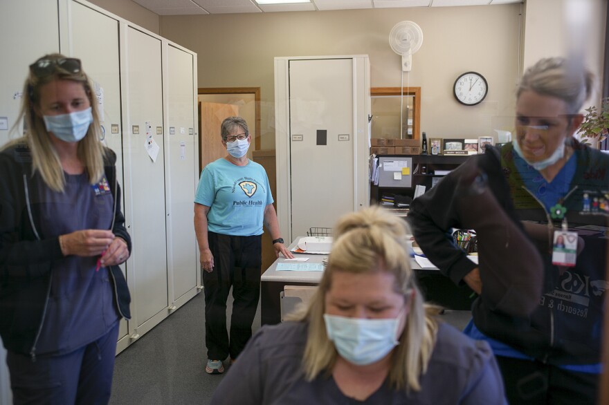 Marshall County Health Department Director Sue Rhodes, center, gathers with her team of nurses at the Health Department building in Marysville, Kansas.