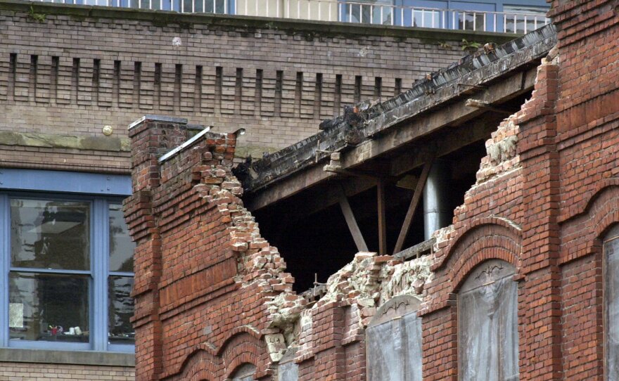 The facade of the building that housed the Fenix Cafe in Seattle's Pioneer Square crumbled following an earthquake Wednesday, Feb. 28, 2001, in Seattle. 