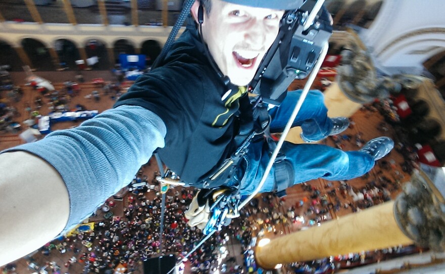 Nate Ball takes a selfie from 120 feet in the air at the top of the National Building Museum in Washington, D.C.