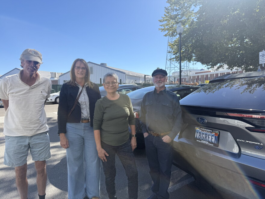 Ken Andrews (from left) stands next to fellow EV and hybrid drivers Ronda Colavito, Chuck Swackhammer, and Cindy Ryan, near his electric 1014 Subaru Solterra in Reno, Nevada, on Sept. 29, 2026.