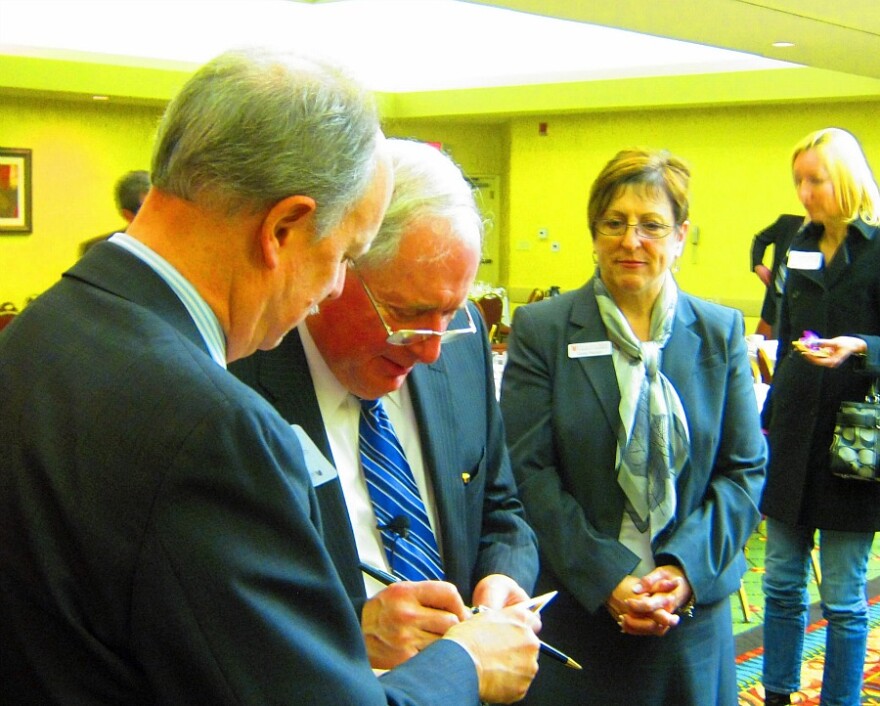 Senator Carl Levin speaks with guests at the Holland-Zeeland Chamber luncheon Monday.