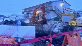 A crew works to repair a water line following the Swan Lake Loop failure in February 2024.