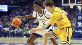 Kentucky's Jaxson Robinson (2) drives near Lipscomb's Joe Anderson, right, during the second half of an NCAA college basketball game in Lexington, Ky., Tuesday, Nov. 19, 2024. (AP Photo/James Crisp)